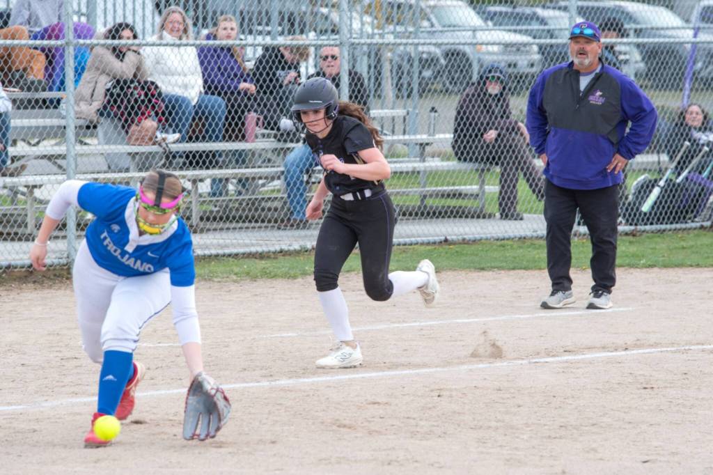 Sequims Rylie Doig makes a play for home plate against Olympic on April 17. The Trojans won the slugfest 17-7 in Sequim.