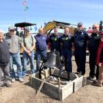 Sequim Gazette photo by Matthew Nash
Lost Mountain Schools original bell is now in front of Sequim Museum & Arts as a joint effort between Clallam County Fire District 3, museum officials and volunteers, and local business Doin Stuff. Pictured from left are Bob Stipe with the museum, Luke and Daniel Berneking with Doin Stuff, Tharin Huisman, CCFD3 maintenance supervisor, firefighter/EMT Ryan Hueter, Captain Ivan Hueter, firefighter/paramedic Joel Bower, Fire Chief Justin Grider, and the museums Executive Director Judy Reandeau Stipe.