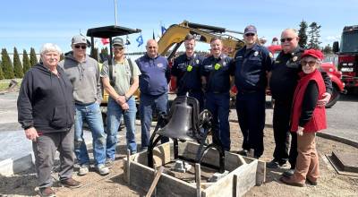 Sequim Gazette photo by Matthew Nash
Lost Mountain Schools original bell is now in front of Sequim Museum & Arts as a joint effort between Clallam County Fire District 3, museum officials and volunteers, and local business Doin Stuff. Pictured from left are Bob Stipe with the museum, Luke and Daniel Berneking with Doin Stuff, Tharin Huisman, CCFD3 maintenance supervisor, firefighter/EMT Ryan Hueter, Captain Ivan Hueter, firefighter/paramedic Joel Bower, Fire Chief Justin Grider, and the museums Executive Director Judy Reandeau Stipe.