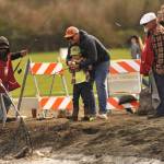 Sequim Gazette photos by Matthew Nash
Colin Banitch helps his son Finn, 5, reel in a trout during Kids Fishing Day with help from volunteers with the North Olympic Peninsula Chapter of Puget Sound Anglers.