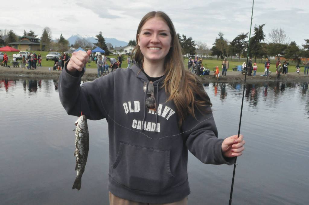Annabelle Hollek, 14, of Seattle holds up a trout she caught at Kids Fishing Day on April 18. She and her family were visiting her grandpa Larry Belmont who is a volunteer with the North Olympic Peninsula Chapter of Puget Sound Anglers.