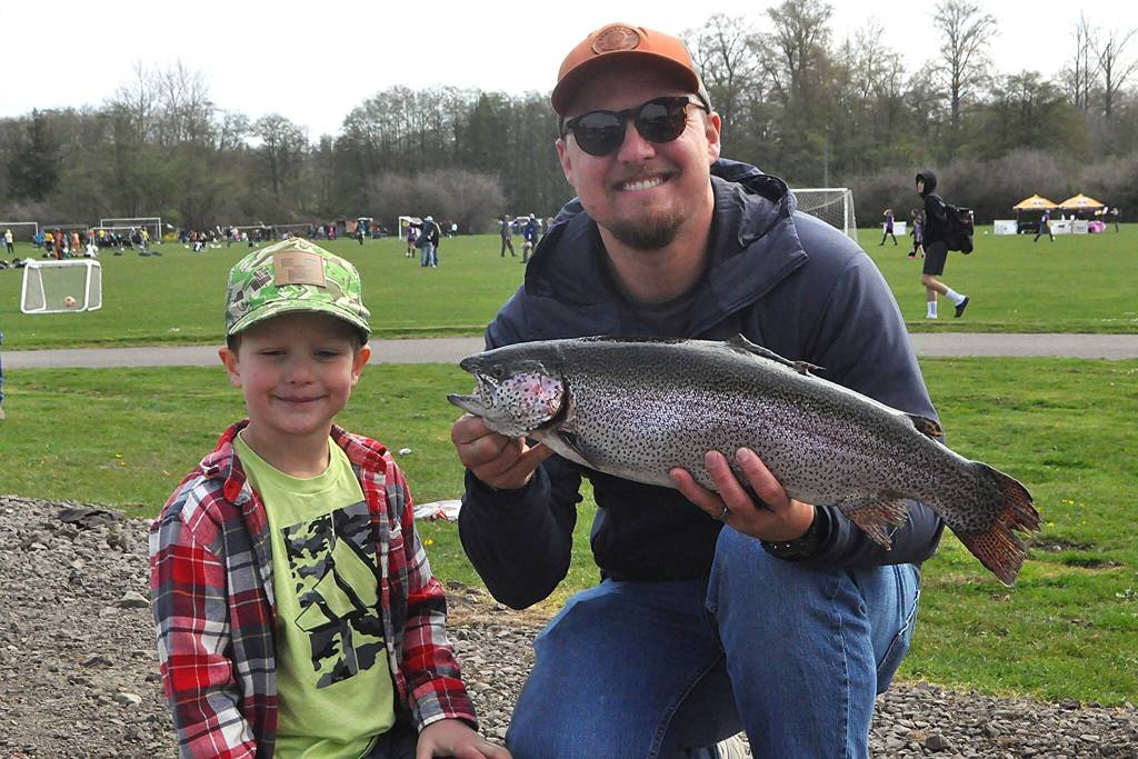 Sequim Gazette photo by Matthew Nash/
About 2,000 trout were placed in the Water Reuse Demonstration Pond in the north side of Carrie Blake Community Park for Kids Fishing Day on April 18. Children 14 and under can fish for free and without a license into the summer.