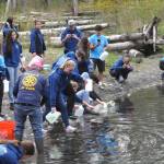 Sequim Gazette photo by Matthew Nash/ Interact Club members fill jugs and cartons to carry hundreds of pounds of water from the Dungeness River to Sequim Middle School as part of their annual Walk for Water fundraiser to purchase and build a well through Rotary International.