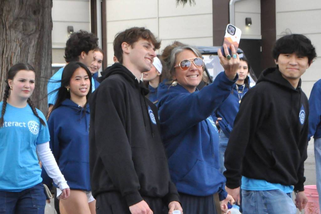Sequim Gazette photo by Matthew Nash/ Interact Club adviser Chelsea Reichner takes a photo with Mason Rapelje and other students during the clubs annual Walk for Water event.