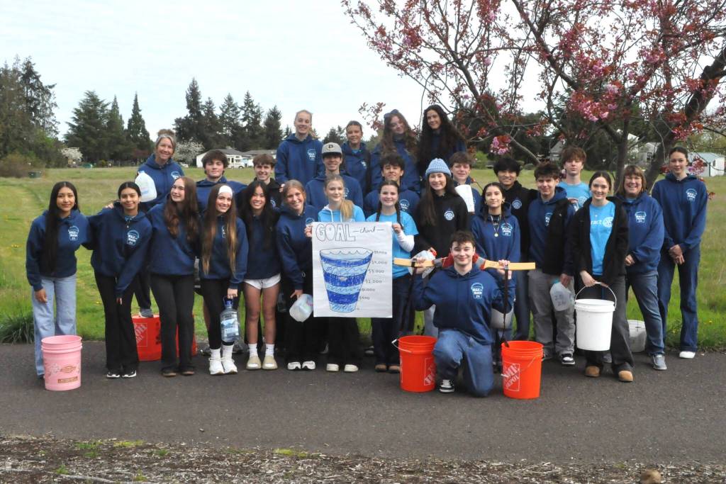 Sequim Gazette photo by Matthew Nash/ Interact Club members gather for a photo before they begin on a four mile hike for the clubs Walk for Water fundraiser.