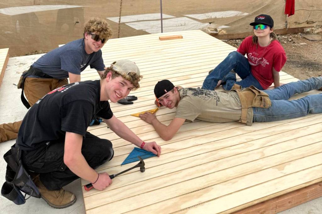 Team members Jacob and Noah Oberly, Alex Creery and Reagan Whitmarsh work on a portion of a home in Mexico during Sequim Community Churchs Mexico mission trip.