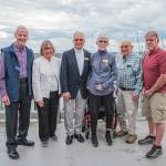 Celebrants at Sequim Bay Yacht Clubs 50th anniversary dinner at John Wayne Marina include, from left to right, Rudy Hessels, historian Jean Hessels-Petit, longest-tenured members Bob and Kelly Macaulay, longest-tenured member Chris Coolures, and Dennis Miller, who was essential in getting the rowing program added to the club 10 years ago.
