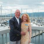 Newlyweds Joel Cziok and Jenn Gibbings pause for a photo at John Wayne Marina amidst the Sequim Bay Yacht Clubs 50th anniversary celebration.