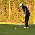 Sequim Gazette photo by Matthew Nash/
Raimey Brewer putts the ball with Kingston golfers in the foreground on April 23. She shot a 42 and had a birdie and four pars.