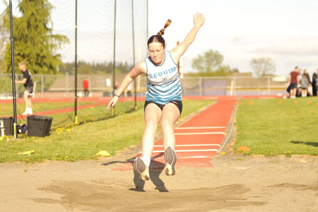 Sequim Gazette photo by Matthew Nash/
Olivia Thompson leaps in the long jump 9-7 on April 22 during Sequim Middle Schools lone home meet of the season. She was one of 40-plus athletes to compete in the event.