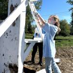 Myka Stewart, 9, paints a portion of the Sequim Police Departments Dog Agility Course in Carrie Blake Community Park on April 25. She and her mom Nikki with Sequim Community Church wanted to help fellow church volunteers for Sequim Beautiful Day.