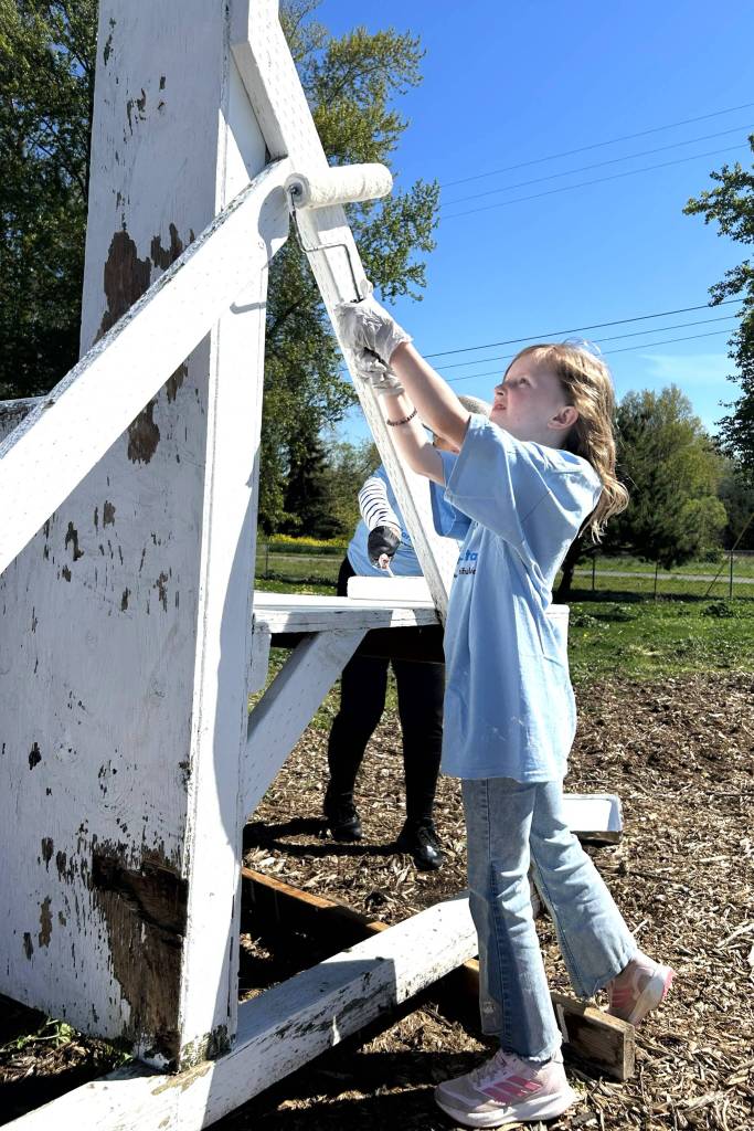 Myka Stewart, 9, paints a portion of the Sequim Police Departments Dog Agility Course in Carrie Blake Community Park on April 25. She and her mom Nikki with Sequim Community Church wanted to help fellow church volunteers for Sequim Beautiful Day.