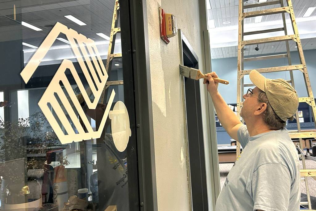 Brian Holden with Sequim Community Church helps paint near the Sequim Boys & Girls Clubs bathrooms during Sequim Beautiful Day. He assisted Sequim Valley Foursquare volunteers during the project. Service work is great, he said. I love to help.