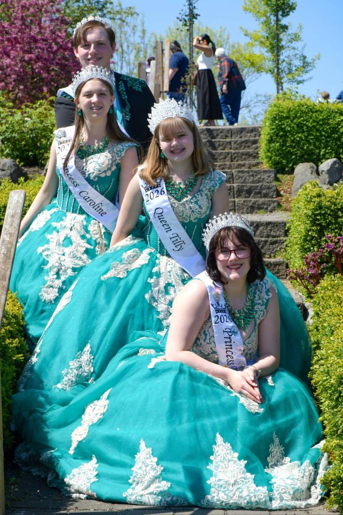 Sequim Gazette photo by Monica Berkseth/ The Sequim Irrigation Festivals royalty, from top, prince Brayden Baritelle, princess Caroline Caudle, queen Tilly Woods, and princess Emma Rhodes pose for a photo in the Sequim Botanical Garden shortly before butterflies were released by families.