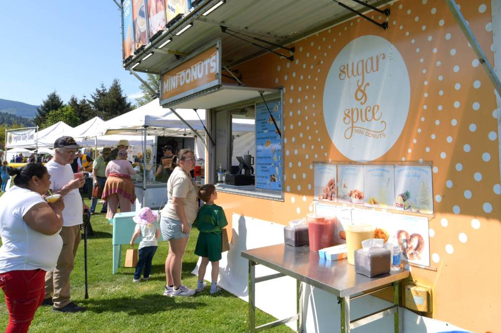 Sequim Gazette photo by Monica Berkseth/ Sugar & Spice mini-doughnuts was one of several food vendors available during Family Fun Days.
