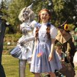 Sequim Gazette photo by Matthew Nash/ Lily Tjemsland, the Tin Girl, and Trinity Devlin, as Dorothy, walk in the Kids Parade promoting the operetta The Wizard of Oz. It continues May 8-10 with shows at 7 p.m. Friday-Saturday, and 2 p.m. Sunday.