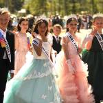 Sequim Gazette photo by Matthew Nash/ Sequim Irrigation Festival junior royalty and button design winners march in the Kids Parade on Saturday.