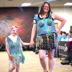 Sequim Gazette photo by Monica Berkseth
Lillian and Amber Freeman wear recycled outfits for the Trashion Show that they call Where the Tide remembers. They reused food and cereal boxes, plastic bags, netting, cans, and more.