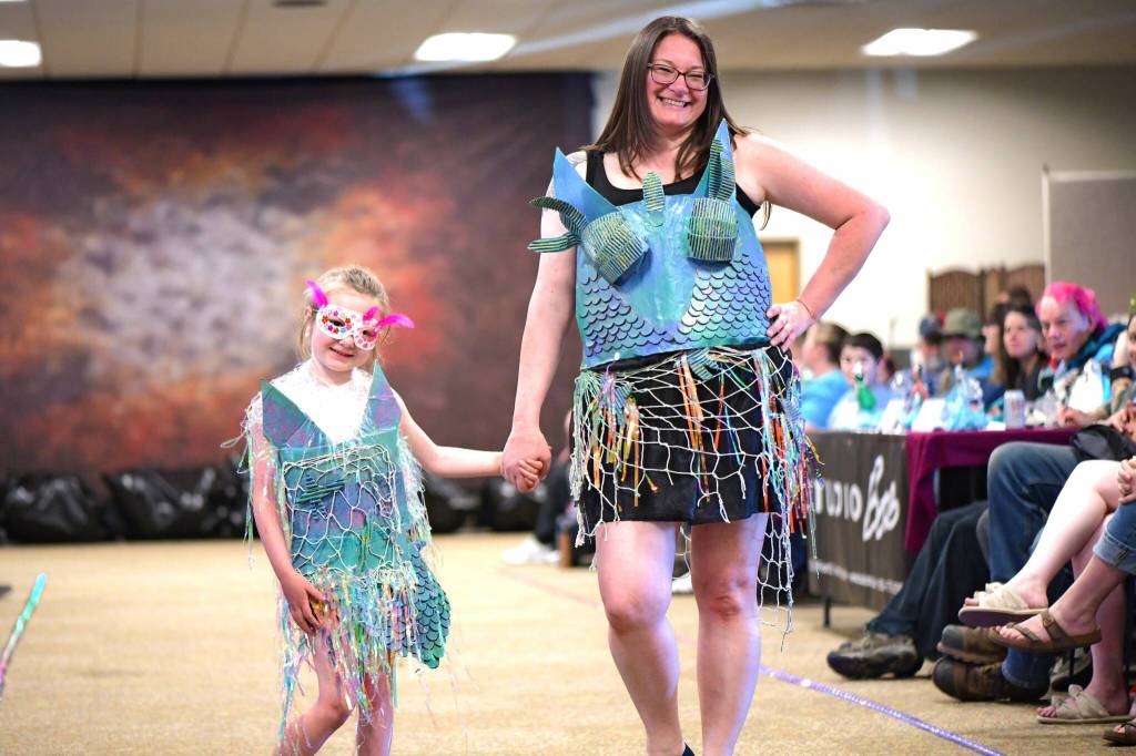 Sequim Gazette photo by Monica Berkseth
Lillian and Amber Freeman wear recycled outfits for the Trashion Show that they call Where the Tide remembers. They reused food and cereal boxes, plastic bags, netting, cans, and more.