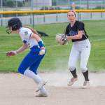 Photo by Emily Matthiessen/ Sequims Ava Ritter looks to throw to first base around a North Mason baserunner in Sequim on April 27.