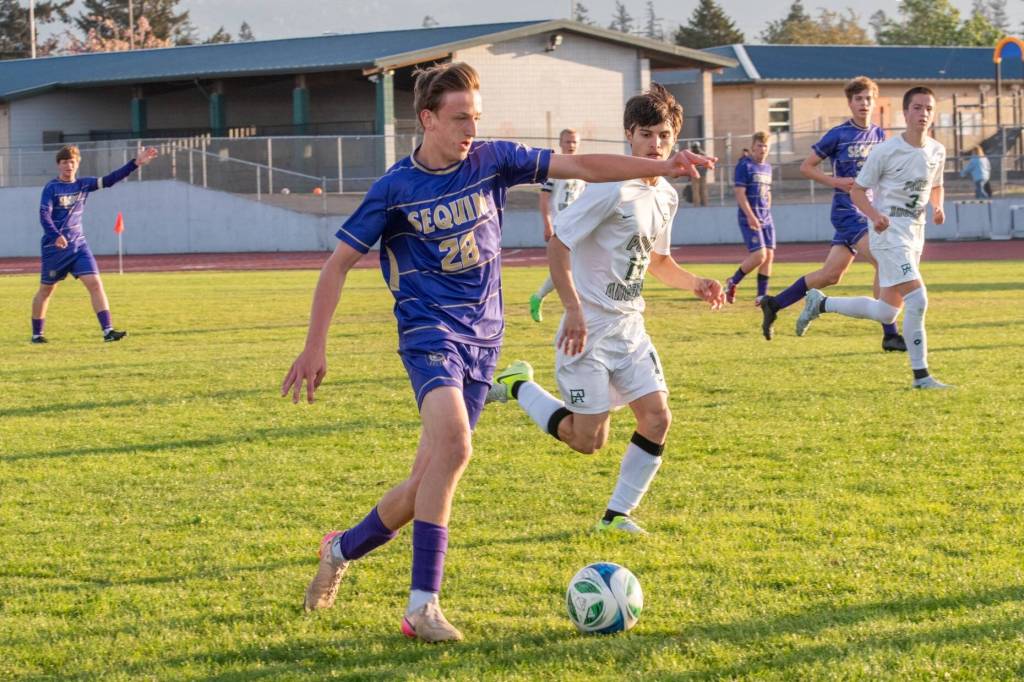 Photo by Emily Matthiessen/ Colten Anderson looks to make a play on Friday for Sequim during a tough defensive battle against Port Angeles.