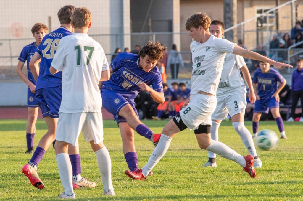 Photo by Emily Matthiessen/ Sequim senior Nico Musso (10) drives the ball forward against Port Angeles players on Friday in Sequim. The Roughriders won a defensive battle 2-0.