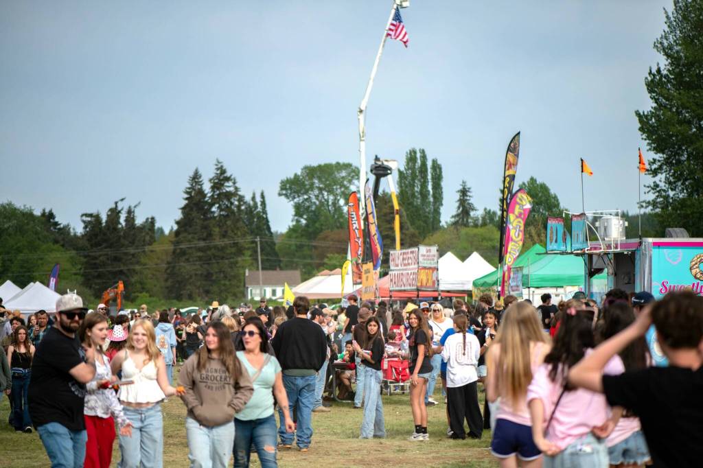 Sequim Gazette photo by Monica Berkseth/ The Sequim Logging Show was packed with people in the Blake lot south of Carrie Blake Community Park with food, games, truck and tractor pulls, a logging show, fireworks and more.