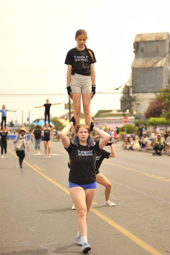 Sequim Gazette photo by Matthew Nash
Sequim Acrobatics members stand tall next to the grain elevator on May 9 during the Sequim Irrigation Festivals Grand Parade.