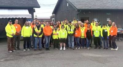 Photo courtesy Sequim Food Bank 
Orange and yellow shirts worn by those at the Sequim Food Bank are springlike colors appropriate for the season, but they have a purpose. Yellow shirts have been worn by volunteers, but now staff are wearing orange so they can be easier to spot when questions arise.