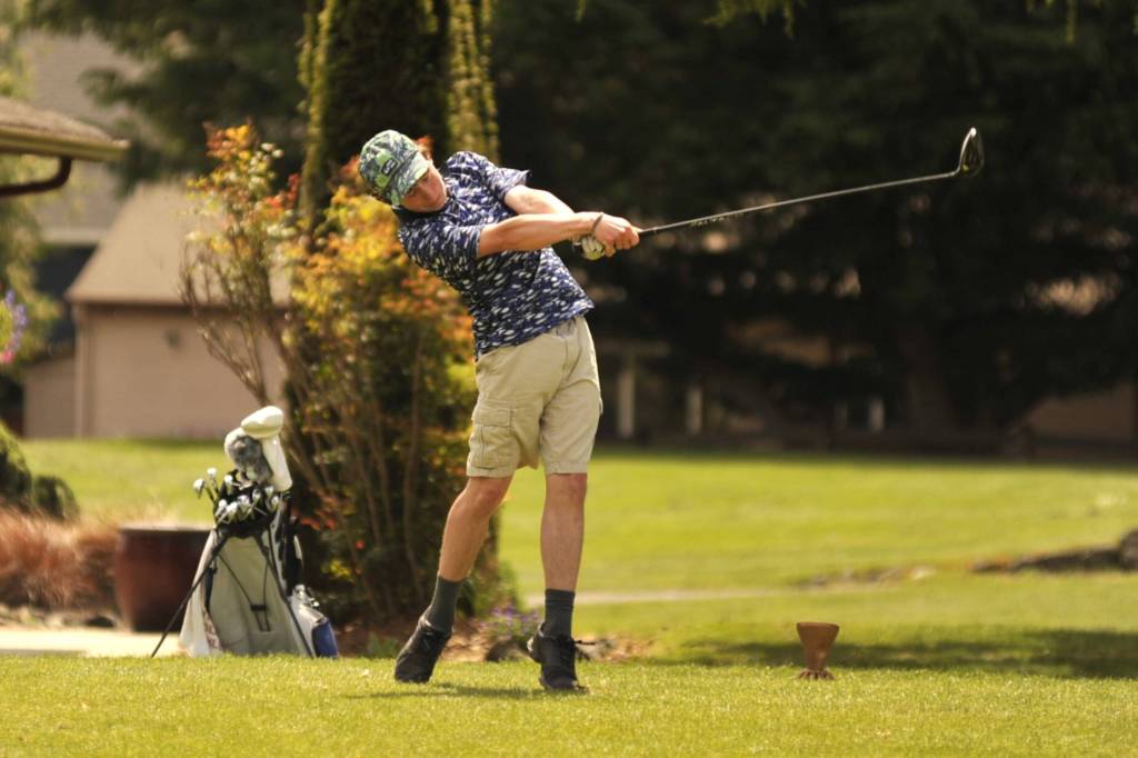 Sequim Gazette photo by Matthew Nash/ Port Angeles Sky Gelder tees off from hole No. 13 at the Class 2A West Central District Championship on Tuesday, May 12 at The Cedars at Dungeness Golf Course. Gelder produced his best round of the season when the pressure was on full force, shooting a 2-over-par 74 to finish one stroke back of district tournament champ Samuel Hodus of Bainbridge.