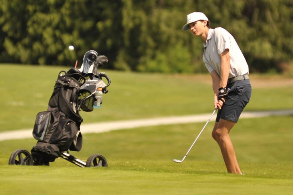 Sequim Gazette photo by Matthew Nash/ Port Angeles Noah Myers hits to the green on hole No. 12 at the Class 2A West Central District Championship on Tuesday, May 12 at The Cedars at Dungeness Golf Course.