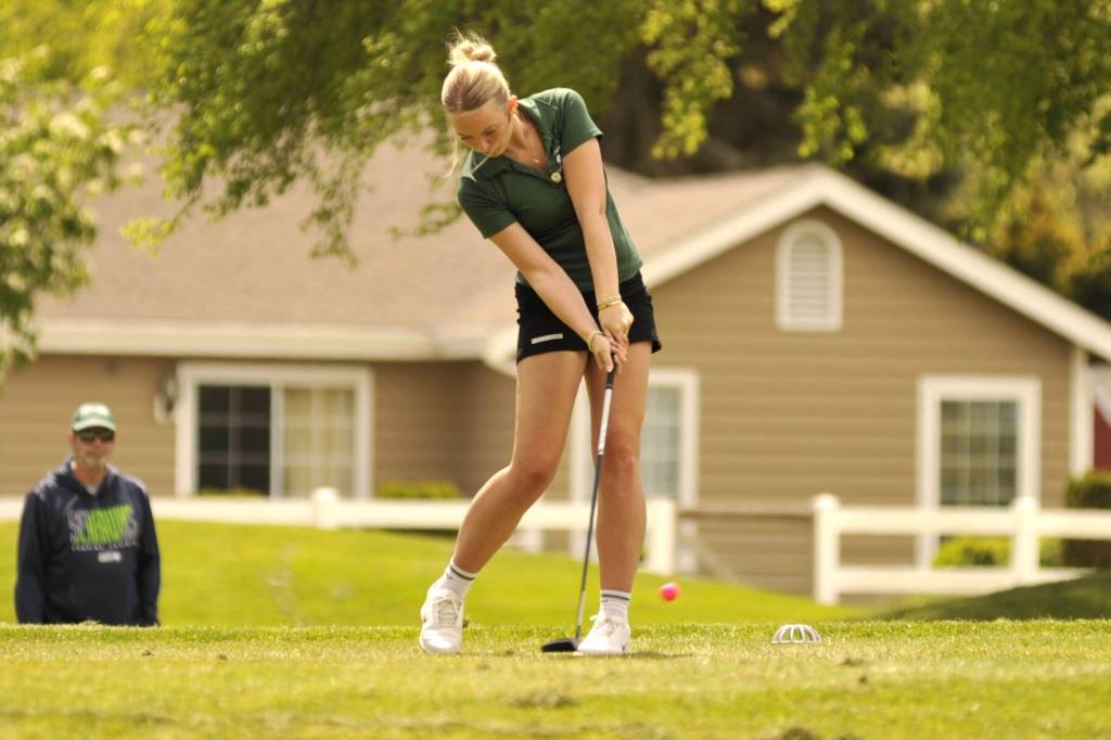 Sequim Gazette photo by Matthew Nash/ Port Angeles sophomore Layla Parker tees off from hole No. six at the Class 2A West Central District Championship on Tuesday, May 12 at The Cedars at Dungeness Golf Course.