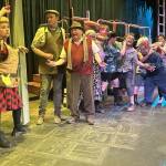 Sequim Gazette photos by Matthew Nash
Ms. Pennywise (Angela Poynter), on left, manages the line for Public Amenity No. 9 in Olympic Theatre Arts production of Urinetown the Musical. Actors next to Poynter, from left, include Hayden Pomeroy as Bobby Strong, Joel Swenning as Old Man Strong, Marni Whitehead as Josephine Strong, August Maberry as Tiny Tom, Claire Wegner as Robby the Stockfish, Matt Forrest as Hot Blades Harry, Gretel Maberry as Billy Boy Bill, Susan Cates as Becky Two Shoes, Shoshanna Feist as Soupy Sue, and Diane Smith as Little Sally.