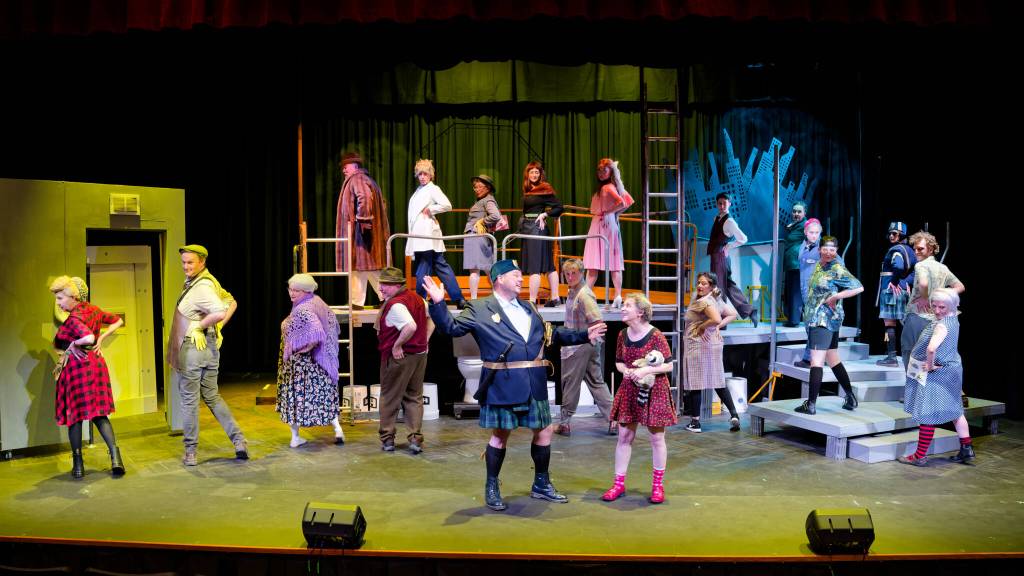 Photo courtesy Mark Klinke/ The full company of Olympic Theatre Arts production of Urinetown the Musical practices the titular song Urinetown during a dress rehearsal.