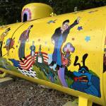 Sequim Gazette photo by Matthew Nash/ As she progressed, Monika Livingstone realized she wanted more than just the four Beatles on her propane tank inspired by the Yellow Submarine, she added multiple characters and images from the animated film.