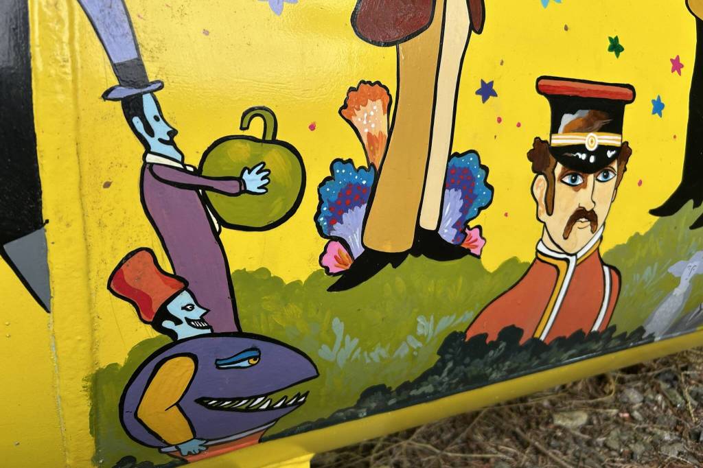 Sequim Gazette photo by Matthew Nash 
The Beatles, Sgt. Peppers Lonely Hearts Club Band, the Blue Meanies, and many other characters make appearances on Monika Livingstones Yellow Submarine mural on her propane tank.