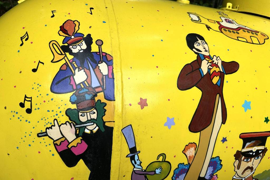 Sequim Gazette photo by Matthew Nash/ The Beatles, Sgt. Peppers Lonely Hearts Club Band, the Blue Meanies, and many other characters make appearances on Monika Livingstones Yellow Submarine mural on her propane tank.