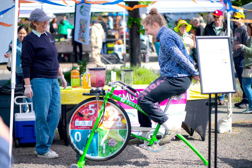 Sequim Gazette photo by Monica Berkseth 
Char Hertel of Port Angeles tries her hand - or rather, feet - at making a pedal-powered smoothie at the City of Sequims A Wheelie Good Day biking event.