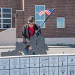 Photos by Emily Matthiessen/
Paul Renick, finance officer for American Legion, Jack Grennan Post No. 62, admires veterans tiles on the Veterans Monument on May 16 at Sequim Museum & Arts, 544 N. Sequim Ave. Volunteer Bob Stipe placed more than 150 new tiles on the wall with space for hundreds more.