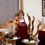 Club instructor Tuttie Peetz stands amid some of her creations at the Olympic Driftwood Sculptors annual Driftwood Art Show, held Saturday and Sunday at the Dungeness River Nature Center. Peetz is one of the founders of the organization, which was formed in 2008.