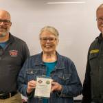 Photos courtesy Charles Meyer
Cindy Zechenelly was honored on May 19 with a Lifetime Achievement Award through the Presidents Volunteer Service Award program managed by Points of Light. Shes served more than 4,000 hours as a co-founder of Sequims Community Emergency Response Teams (CERT), sponsored by Clallam County Fire District 3. Here Zechenelly is recognized by fire commissioner President Bill Miano, left, and Fire Chief Justin Grider.