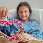 Photo courtesy Caleb Messinger
Ashtyn Messinger, a home-schooled sixth grader who participates in Sequim youth sports, displays the heart she made before going into surgery at Seattle Childrens Hospital. Doctors installed a defibrillator after Ashtyn suffered cardiac arrest on a soccer field at Carrie Blake Community Park on Sunday, May 17.