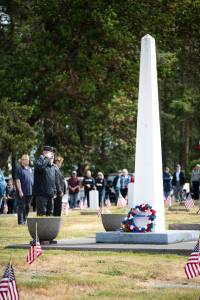 Sequim Gazette photos by Monica Berkseth
American Legion Post 62 Sergeant-at-Arms Mark Dunham salutes after laying a wreath at the base of the monument at Sequim View Cemetery during Mondays Memorial Day Service.