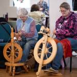 Sequim Gazette photos by Monica Berkseth
Susan Kroll and Jennifer Pelikan with North Olympic Shuttle & Spindle Guild demonstrate spinning during the annual Shepherds Festival on Monday, May 25.