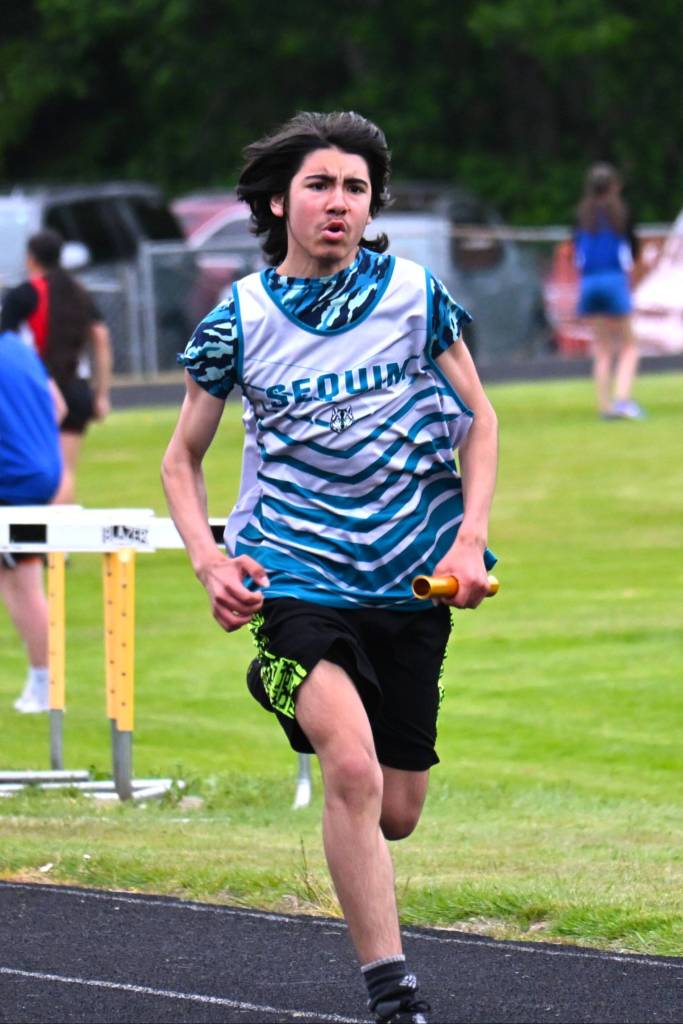 Photo by Liv Thompson/ Leo Rivas runs his leg of the 4x100 meter relay. He ran with Tomas Gonzalez, Jack Jacobs, and Owen DeAngelo to take fifth place (59.08).