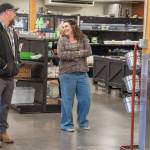 Perry shares a light moment with Market Manager Analise Graziani inside The Market area of the expansive warehouse at 632 N. Oakridge Dr. that was once a Budweiser distribution site.
