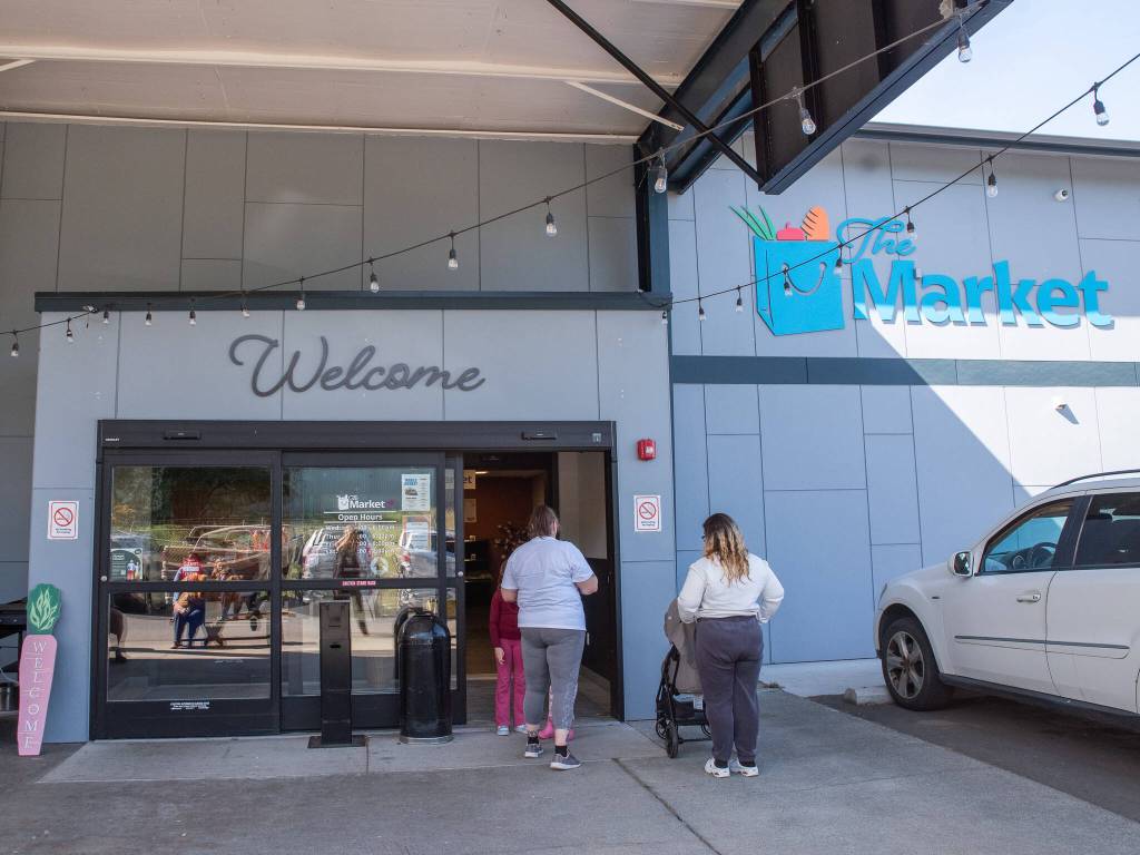 Doors open on a recent weekday to allow waiting clients of the Port Angeles Food Bank to come inside.