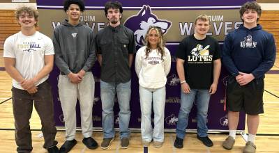 Sequim Gazette photo by Matthew Nash
Six of the 11 student athletes moving on to play sports in college were in attendance for a ceremonial signing event on May 29. They include, from left, Ezekiel Zeke Schmadeke football for Linfield University (Oregon), Solomon Sheppard basketball at Pierce College, Colin Feik soccer for Peninsula College, Sydney Thomas-Harris flag football for Hastings College (Nebraska), Brayden Wopperer football for Pacific Lutheran University, and Andrew Keeler football for University of Mary-North Dakota. Not pictured are Adrian Aragon going on to play golf for Olympic Community College, Lincoln Bear baseball for Heston College in Kansas, Raimey Brewer soccer for Peninsula College, Kaiden Tosland soccer with YWC (YesWeCollege) in Genoa, Italy, and Johnny Vilona wrestling for Evergreen State.