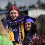 Sequim Gazette photo by Matthew Nash/ Augustus Parry and Sofia Chavez stand together for a photo op after graduation.
