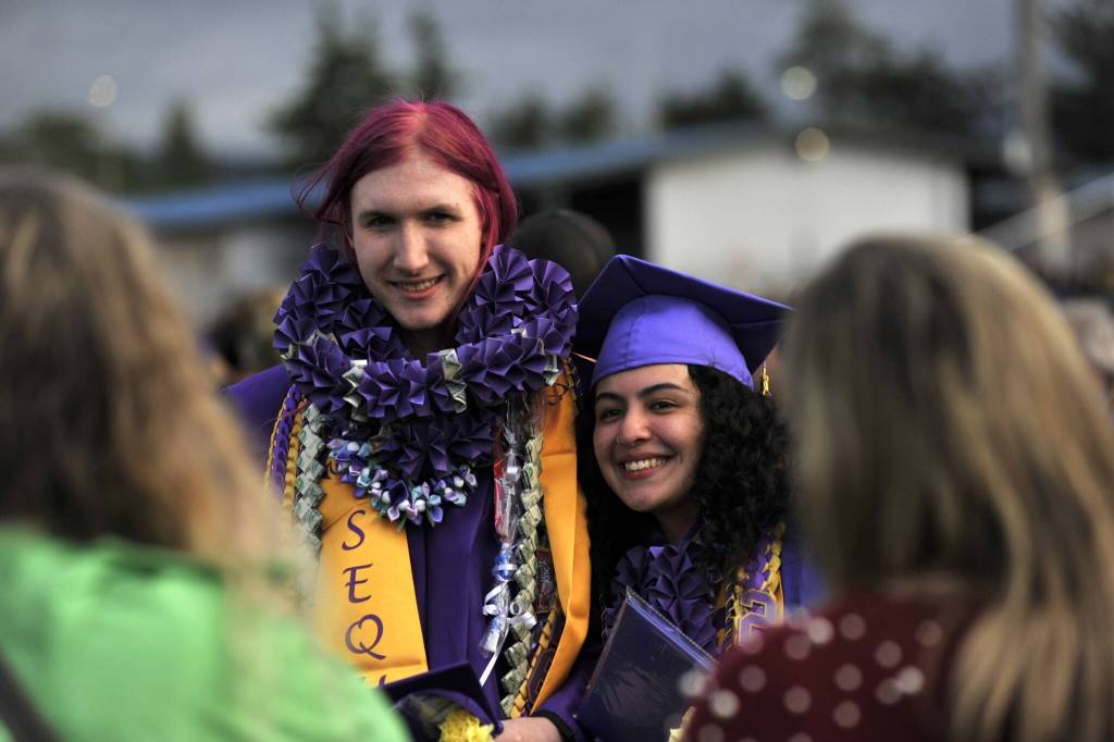 Sequim Gazette photo by Matthew Nash/ Augustus Parry and Sofia Chavez stand together for a photo op after graduation.